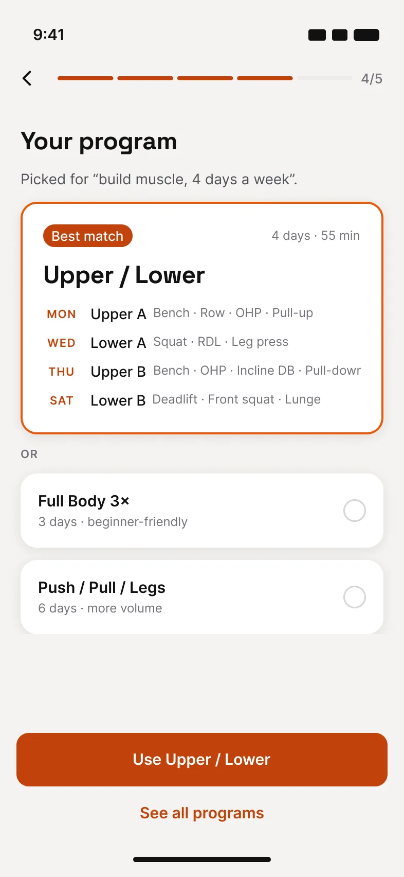 Voltra's program screen picking Upper / Lower for build muscle, 4 days a week, with the Monday, Wednesday, Thursday and Saturday sessions listed.